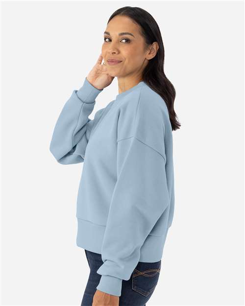 Next Level 9087 Women's Heavyweight Crewneck Sweatshirt - Stonewash Denim - model side