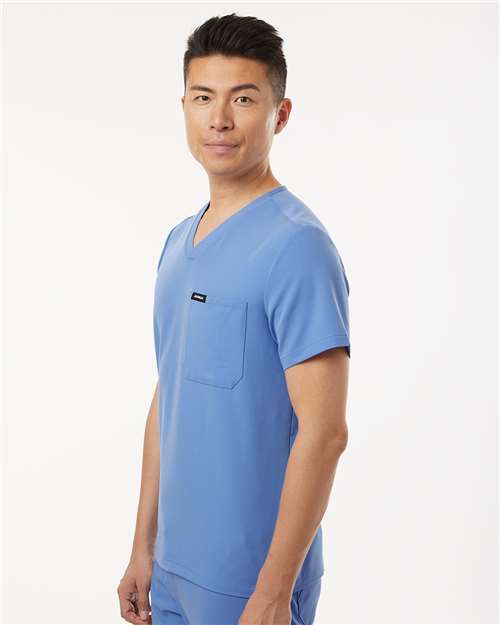 Jaanuu M10001 Men's Holmes Everyday 1-Pocket Scrub V-Neck Top - Ceil Blue - model side