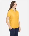 Core 365 CE112W Women's Fusion ChromaSoft Pique Polo - Campus Gold - model side