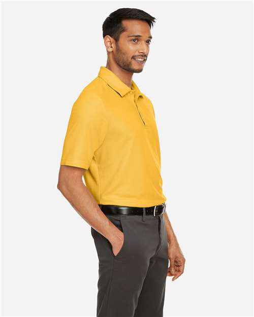 Core 365 CE112 Men's Fusion ChromaSoft Pique Polo - Campus Gold - model side