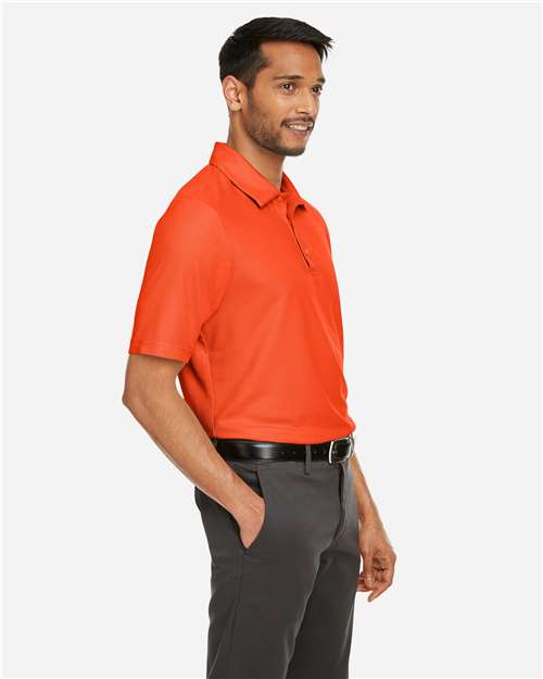 Core 365 CE112 Men's Fusion ChromaSoft Pique Polo - Campus Orange - model side