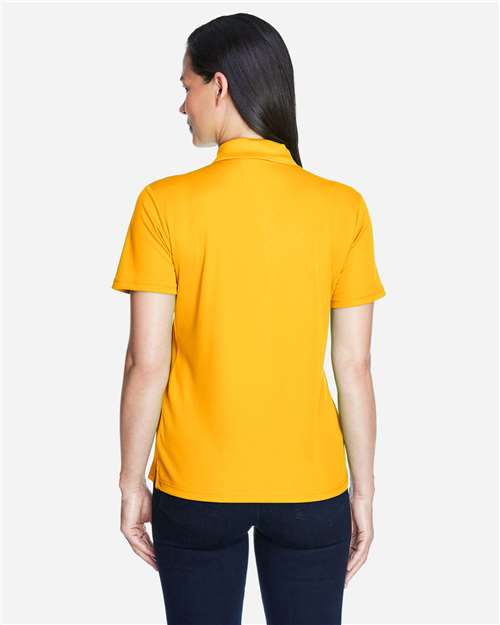 Core 365 78181 Women's Origin Performance Piqué Polo - Campus Gold - model back