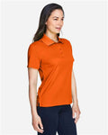 Core 365 78181 Women's Origin Performance Piqué Polo - Campus Orange - model side