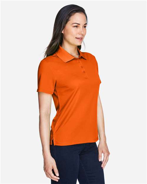 Core 365 78181 Women's Origin Performance Piqué Polo - Campus Orange - model side