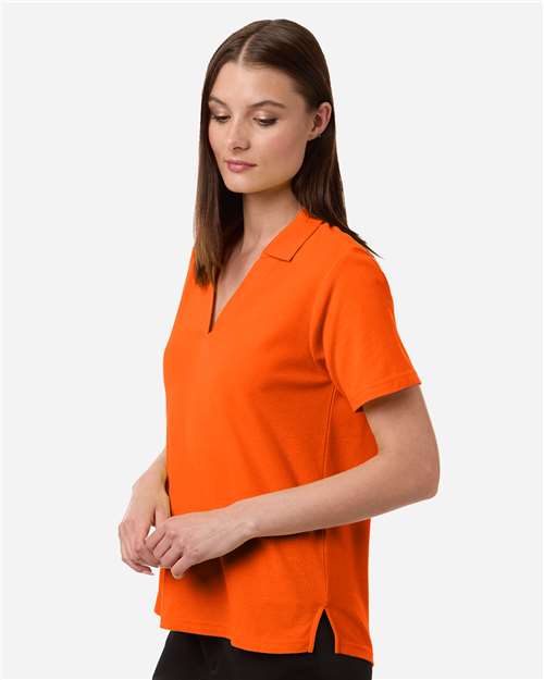 Core 365 CE106W Women's Resolve CVC Performance Pique Polo - Campus Orange - model side