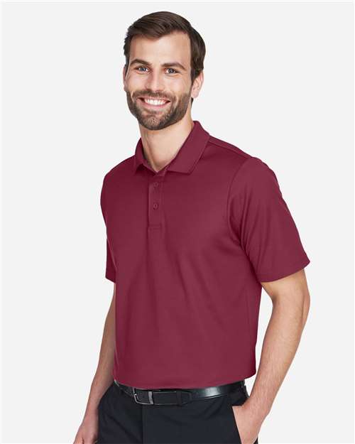 Devon & Jones DG20 Men's CrownLux Performance Plaited Polo - Burgundy - model side
