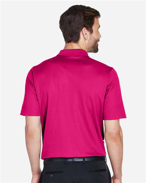 Devon & Jones DG20 Men's CrownLux Performance Plaited Polo - Crown Raspberry - model back