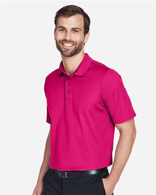 Devon & Jones DG20 Men's CrownLux Performance Plaited Polo - Crown Raspberry - model side
