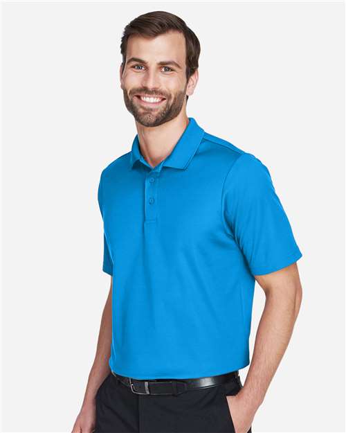Devon & Jones DG20 Men's CrownLux Performance Plaited Polo - Ocean Blue - model side