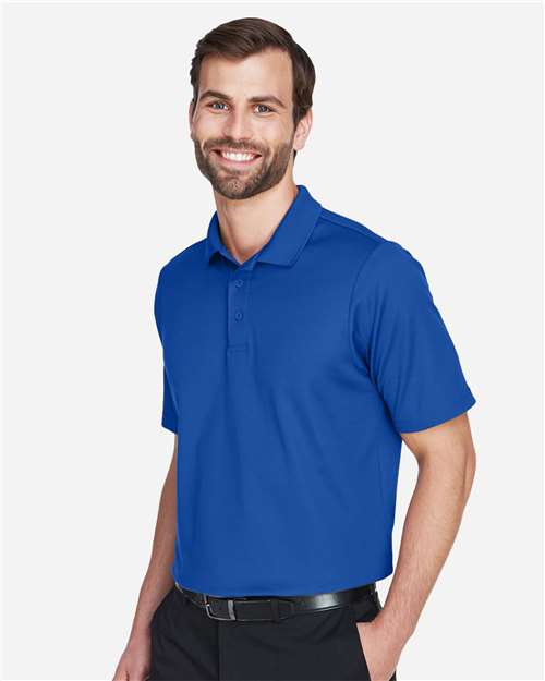 Devon & Jones DG20 Men's CrownLux Performance Plaited Polo - True Royal - model side