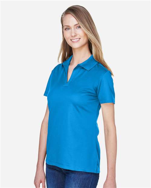 Devon & Jones DG20W Women's CrownLux Performance Plaited Polo - Ocean Blue - model side