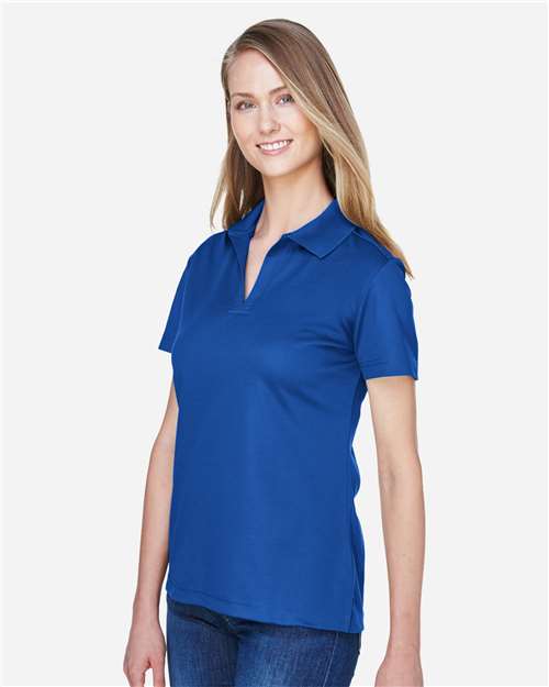 Devon & Jones DG20W Women's CrownLux Performance Plaited Polo - True Royal - model side