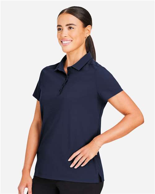 Devon & Jones DG110W Women's CrownLux Performance Windsor Welded Polo - Navy - model side