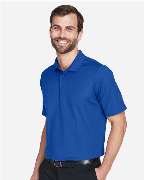 Devon & Jones DG20T Men's Tall CrownLux Performance Plaited Polo - True Royal - model side