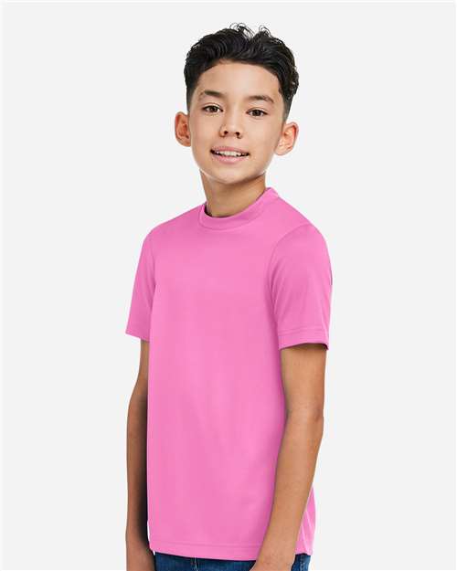 Team 365 TT15Y Youth Zone Performance Mesh T-Shirt - Sport Charity Pink - model side