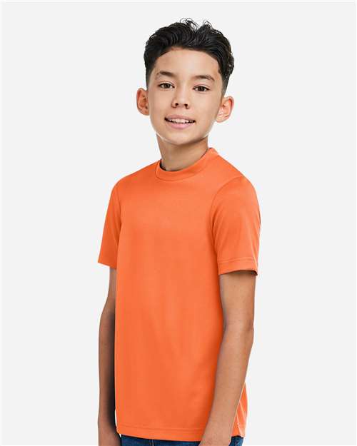 Team 365 TT15Y Youth Zone Performance Mesh T-Shirt - Sport Orange - model side