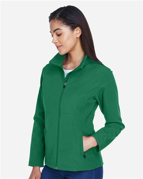 Team 365 TT80W Women's Leader Soft Shell Jacket - Sport Kelly - model side
