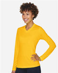 Team 365 TT11WL Women's Zone Performance Long Sleeve T-Shirt - Sport Athletic Gold - model side