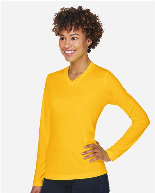 Team 365 TT11WL Women's Zone Performance Long Sleeve T-Shirt - Sport Athletic Gold - model side