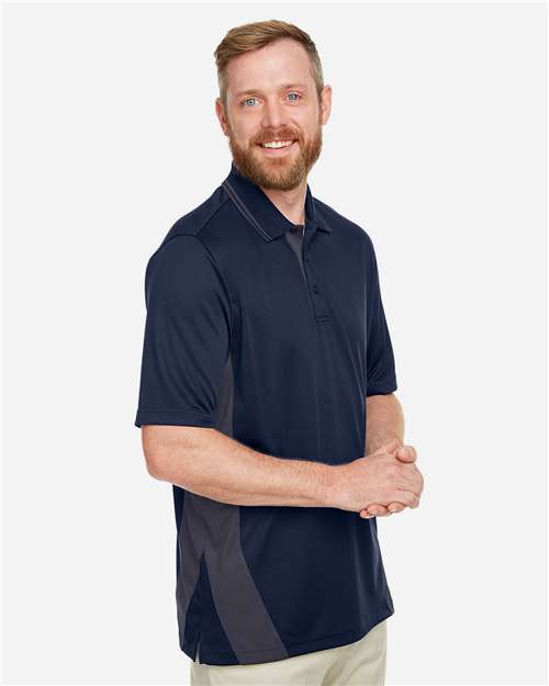 Harriton M386 Men's Flash Snag Protection Plus IL Colorblock Polo - Dark Navy/ Dark Charcoal - model side