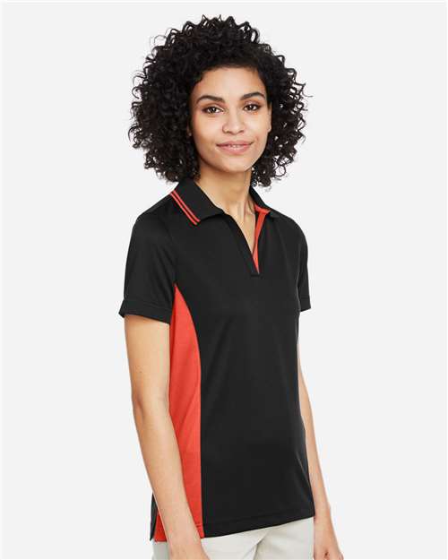 Harriton M386W Women's Flash Snag Protection Plus IL Colorblock Polo - Black/ Team Orange - model side