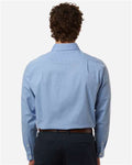 Devon & Jones DG505 Men's CrownLux Performance Spencer Poplin Dress Shirt - Light Blue Melange - model back