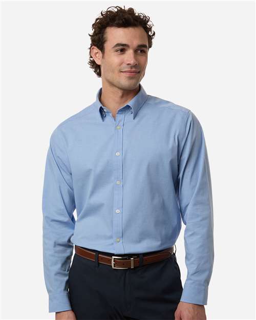 Devon & Jones DG505 Men's CrownLux Performance Spencer Poplin Dress Shirt - Light Blue Melange - model front