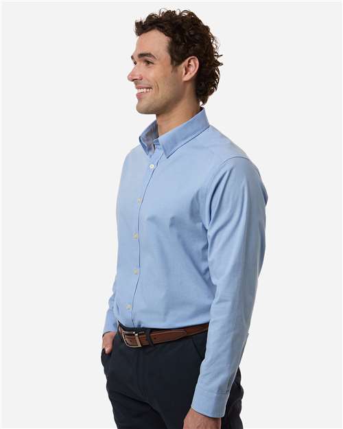 Devon & Jones DG505 Men's CrownLux Performance Spencer Poplin Dress Shirt - Light Blue Melange - model side