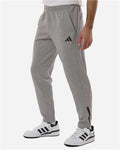 Adidas AT218 Men's Game & Go Fleece 3-Bar Sweatpants - Medium Grey Heather - model side