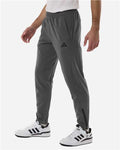 Adidas AT218 Men's Game & Go Fleece 3-Bar Sweatpants - Team Grey Four - model side