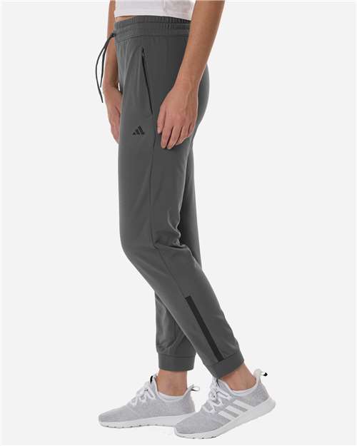 Adidas AT219 Women's Game & Go Fleece Sweatpants - Team Grey Four - model side