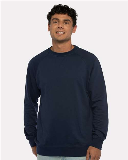 Next Level 9000 Unisex Laguna Raglan Crewneck Sweatshirt - Midnight Navy - model front