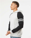 Jerzees 97CR Unisex Nublend Varsity Colorblocked Raglan Hooded Sweatshirt - Oatmeal Heather/ Black Ink - model side