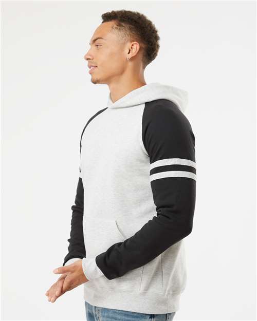 Jerzees 97CR Unisex Nublend Varsity Colorblocked Raglan Hooded Sweatshirt - Oatmeal Heather/ Black Ink - model side