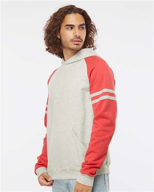 Jerzees 97CR Unisex Nublend Varsity Colorblocked Raglan Hooded Sweatshirt - Oatmeal Heather/ Fiery Red Heather - model side